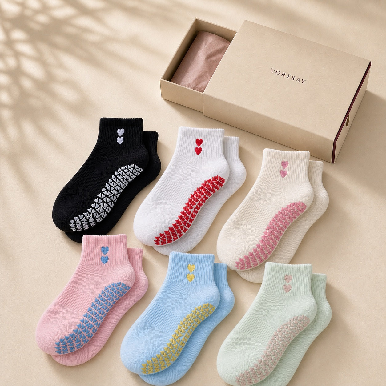 All six VORTRAY grip sock colorways with an ivory drawer box