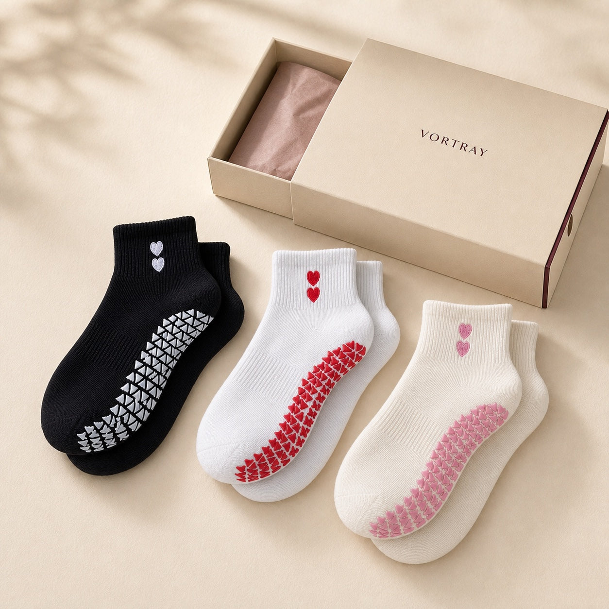VORTRAY Core Trio grip socks in black, white and cream with an ivory drawer box